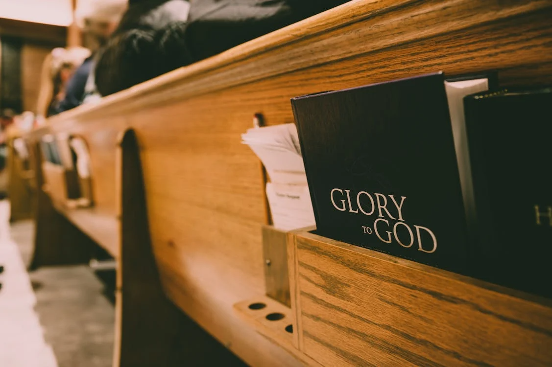 An image of a glory of God book in a church.