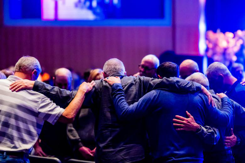 An image of people praying together.