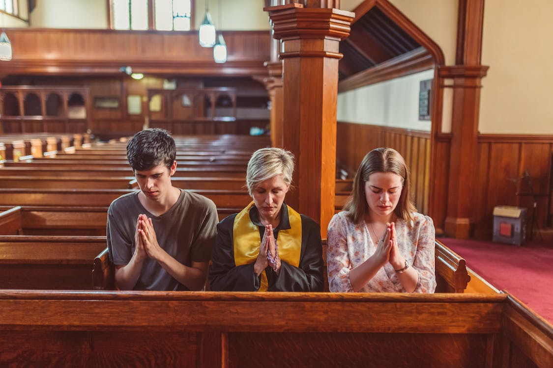 This photo shows some people praying together. 